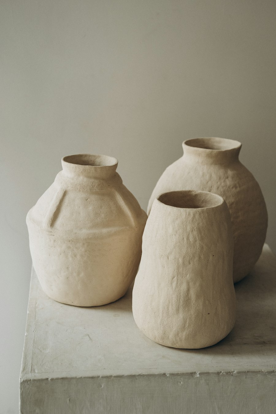 Handmade ceramic vessels on a plinth